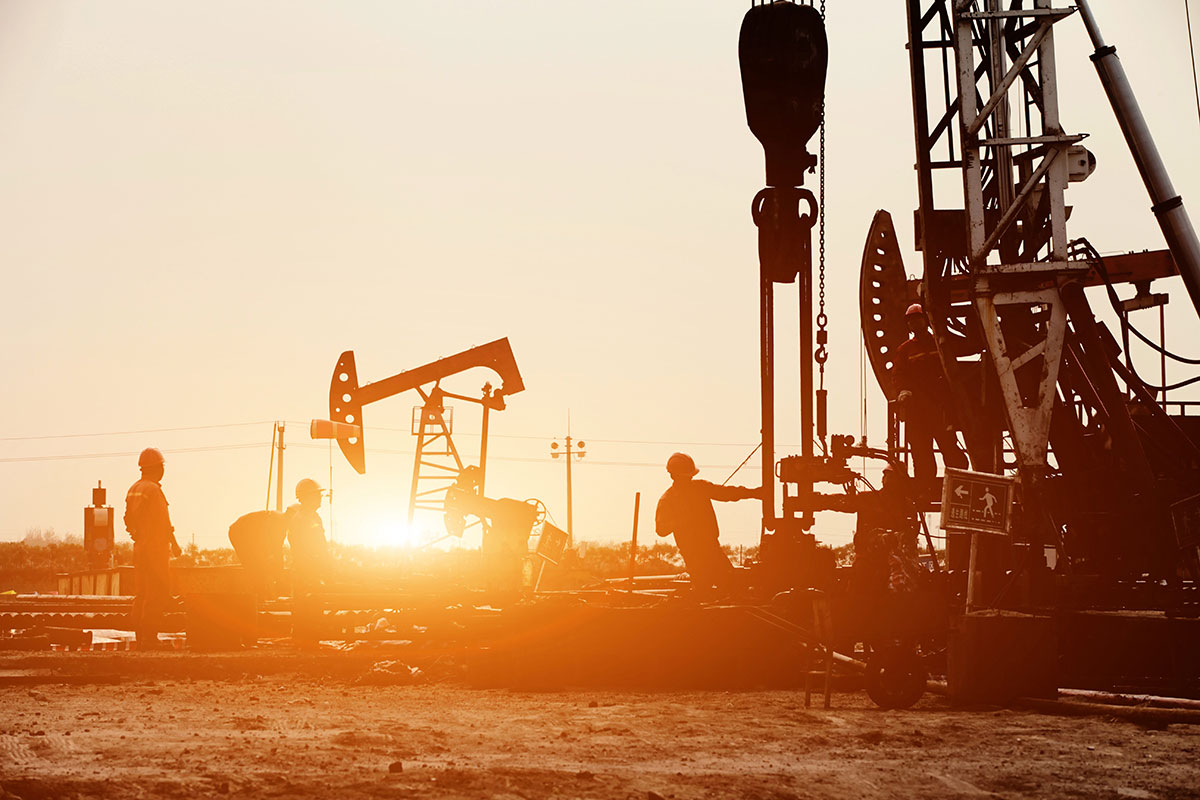 An oil rig at sunset.